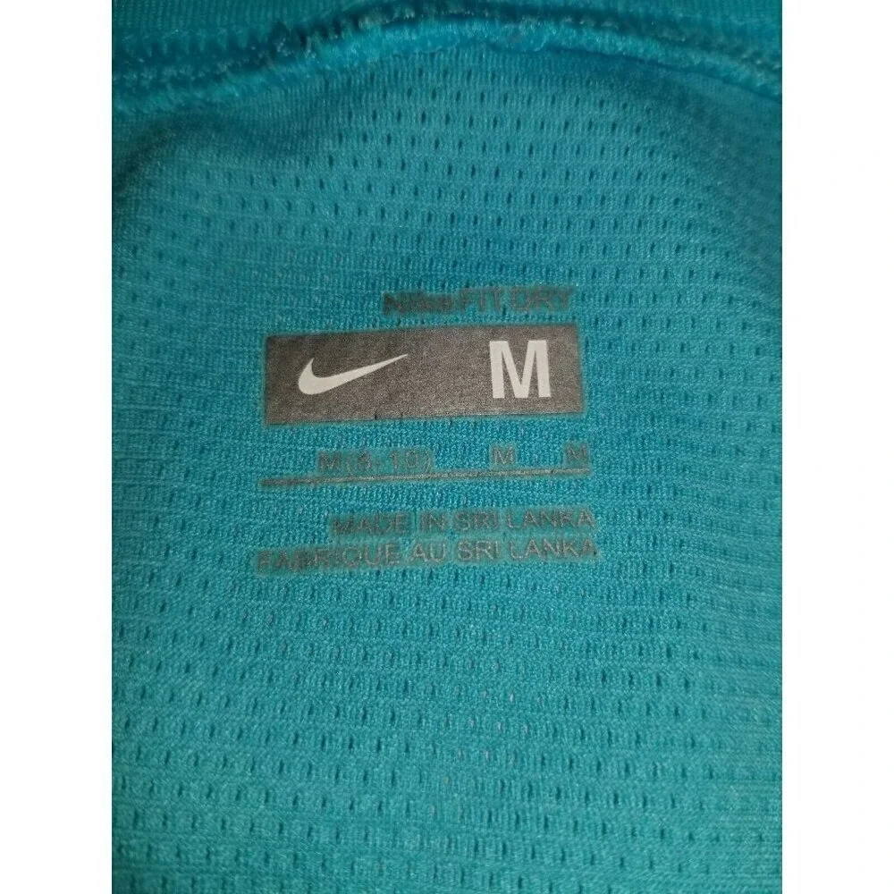 Nike's fit dry Junior sz medium blue‎ shirt with cap Sleeves vented back panel